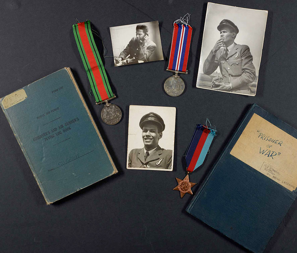 ww2 items relating to Cy Grant's wartime career including log book and medals